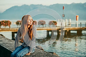 Outdoor fashion portrait of pretty little preteen girl