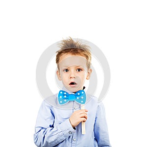 Cute little school boy with blue paper bow-tie isolated on a white background