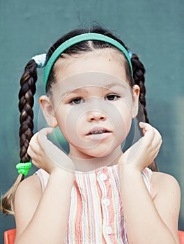 Cute little Ð°sian girl with pigtails