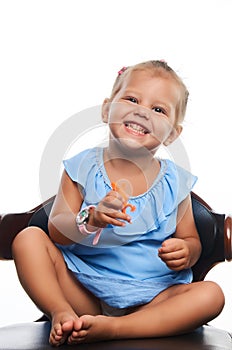 Cute little smiling girl portrait over gray background