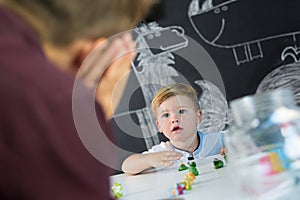 Cute little toddler boy at child therapy session.