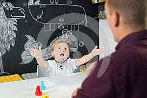 Cute little toddler boy at child therapy session.