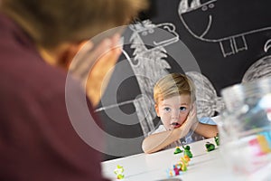 Cute little toddler boy at child therapy session.