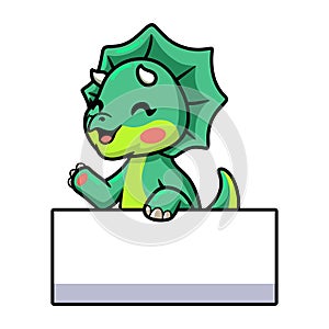Cute little triceratops dinosaur cartoon with blank sign