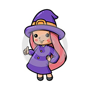 Cute little witch girl cartoon giving thumb up