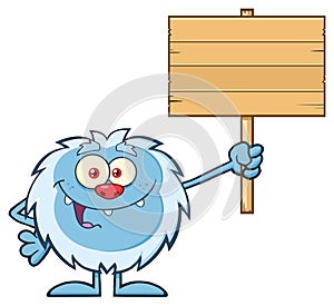 Cute Little Yeti Cartoon Mascot Character Holding To A Wooden Blank Sign