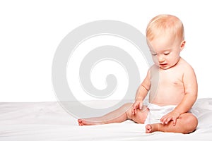 Cute lonely baby infant sitting
