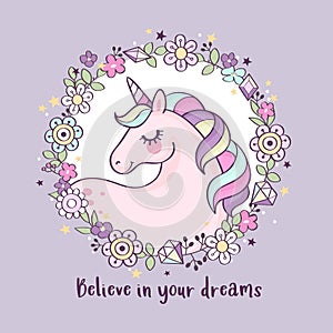 Cute magical unicorn in a flower wreath with inscription `Believe in your dreams`