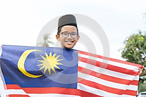 Cute Malay boy with the Flag of Malaysia