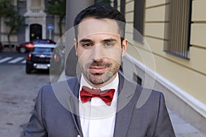 Cute man wearing red velvet bow tie