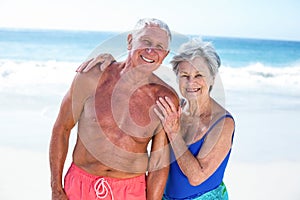 Cute mature couple embracing on the beach