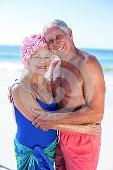 Cute mature couple hugging on the beach