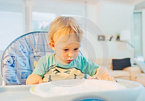 Cute, messy baby eating