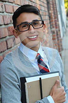 Cute middle school boy outside classroom