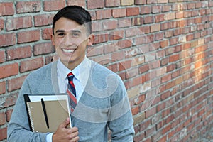 Cute middle school boy outside classroom