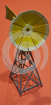 Cute miniature yellow toy windmill