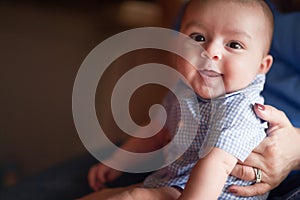 Cute Mixed Race Infant Having Fun with His Parents