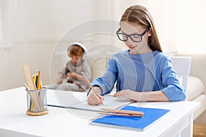 Cute motivated girl being a diligent student