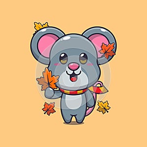 Cute mouse holding autumn leaf.