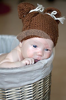 Cute newborn baby in a basket