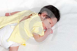 Cute newborn baby boy lie prone