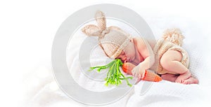 Cute newborn baby boy wearing knitted bunny costume