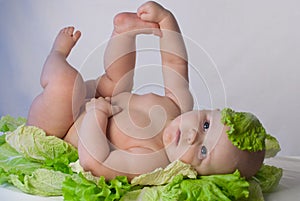 Cute newborn baby in the cabbage