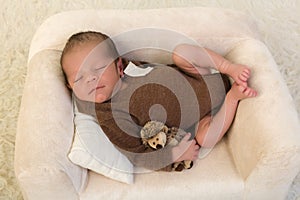 Cute newborn baby on couch