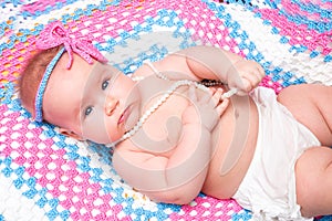 A cute newborn baby girl sleeping. Sweet little baby portrait. Use the photo to represent life, parenting or childhood