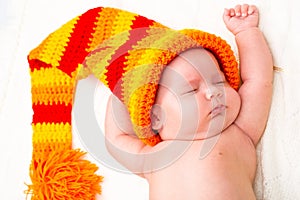 A cute newborn baby girl sleeping. Sweet little baby portrait. Use the photo to represent life, parenting or childhood