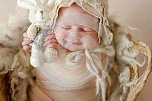 Cute newborn baby girl studio portrait