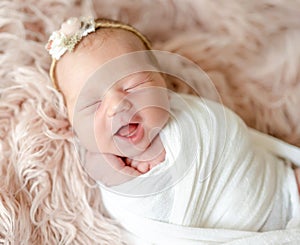 Cute newborn baby girl studio portrait