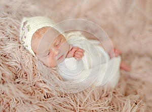 Cute newborn baby girl studio portrait