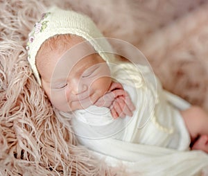 Cute newborn baby girl studio portrait