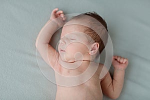 Cute newborn baby sleeping on gray blanket. Baby goods packaging template. Healthy and medical concept. Copy space