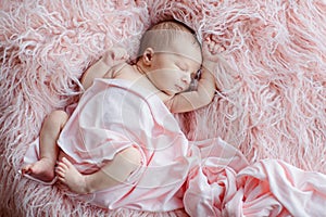 Cute newborn baby sleeping on pink blanket. Baby goods packaging template. Healthy and medical concept. Copy space