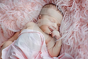 Cute newborn baby sleeping on pink blanket. Baby goods packaging template. Healthy and medical concept. Copy space