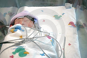 Cute newborn girl sleeping his audi test