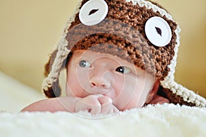 Cute newborn wearing funny hat