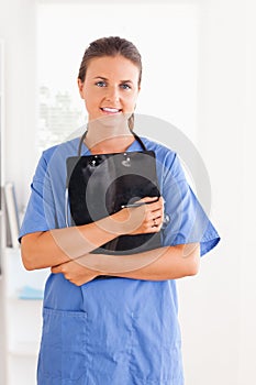 Cute nurse holding a folder