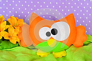 Cute orange owl. Handmade toy for children. Kids sewing crafts. Needlework idea