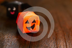 Cute origami Halloween haunted pumpkin and bat