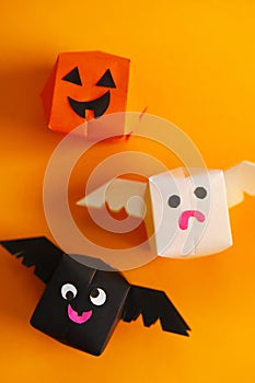 Cute origami Halloween haunted pumpkin, bat and ghost