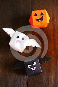 Cute origami Halloween haunted pumpkin, bat and ghost