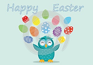 A cute owl has a happy smile and turns many colorful Easter eggs