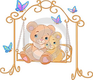 Pair of bears on a swing photo