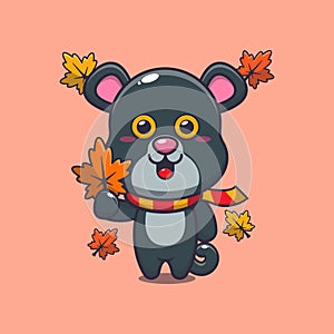 Cute panther holding autumn leaf.