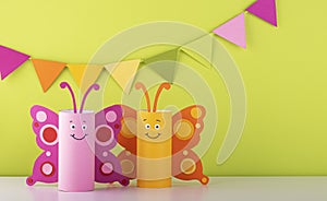 Cute paper butterfly made from a toilet paper tube. spring background