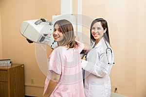 Cute patient getting a mammography