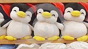 cute penguin animal doll on the toy shelf